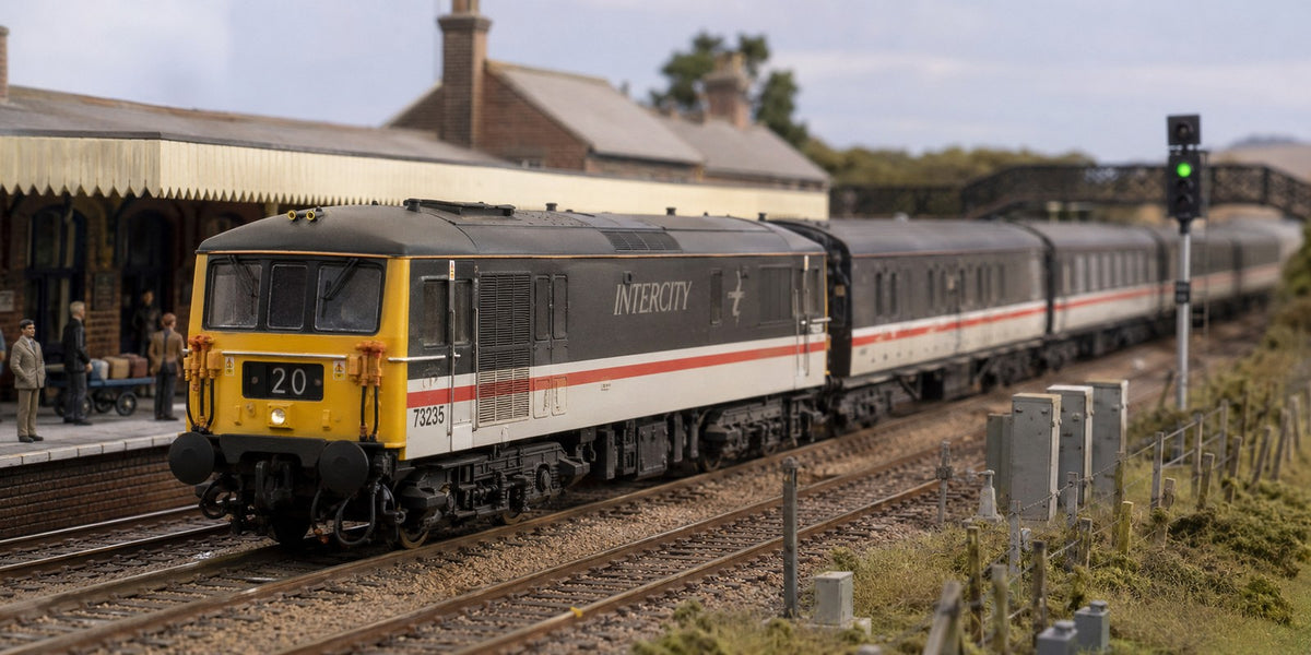 Class 73 locomotive 73235 in InterCity livery at a station platform, OO gauge model railway