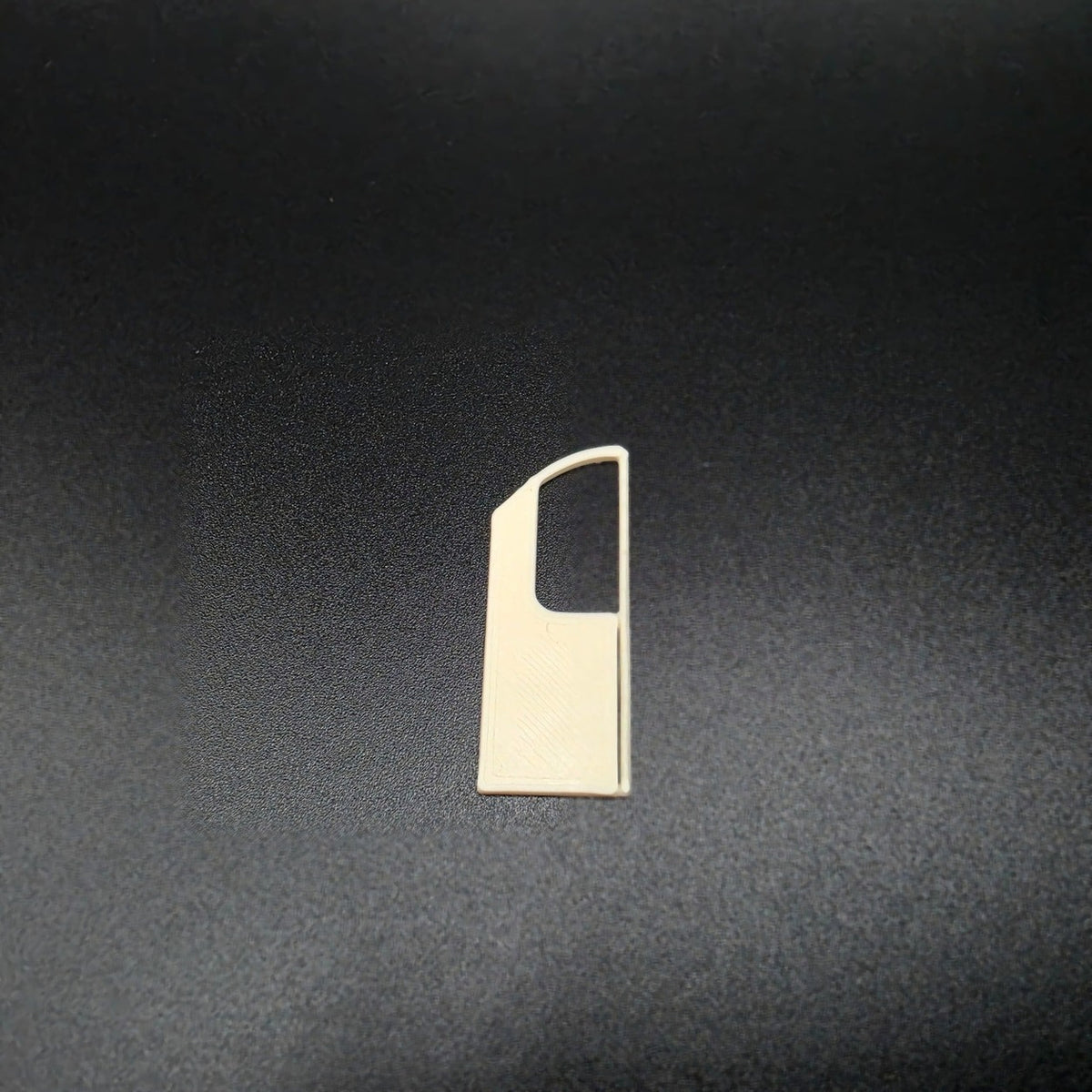 Genuine Bone White 3D-printed Class 455 doorway panel on a dark background