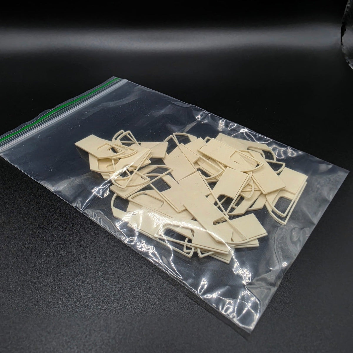 Pack of 40 Bone White OO gauge Class 455 doorway panels in a clear bag