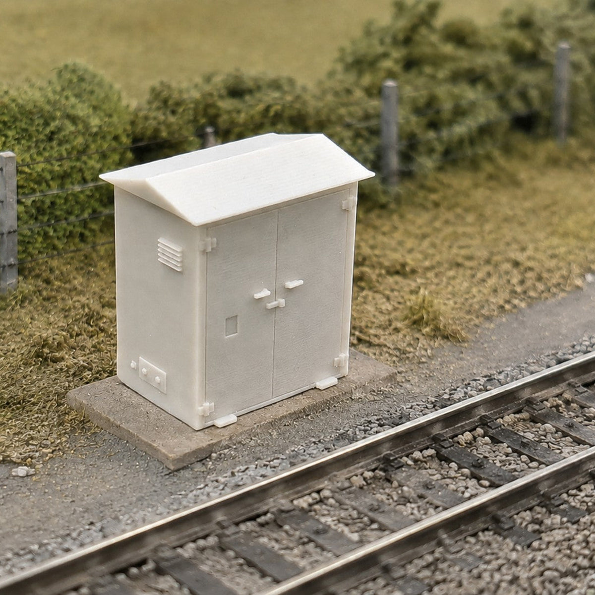 OO gauge lineside electrical cabinet in a trackside scene beside the running line