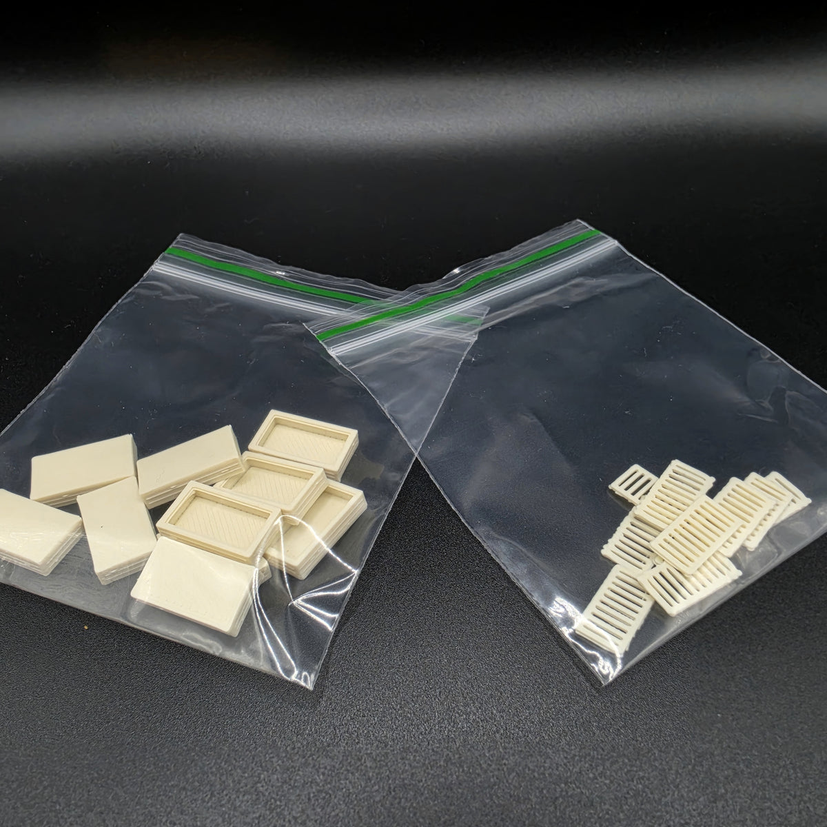 Pack contents for ten unpainted Bone White OO gauge drainage catchpits