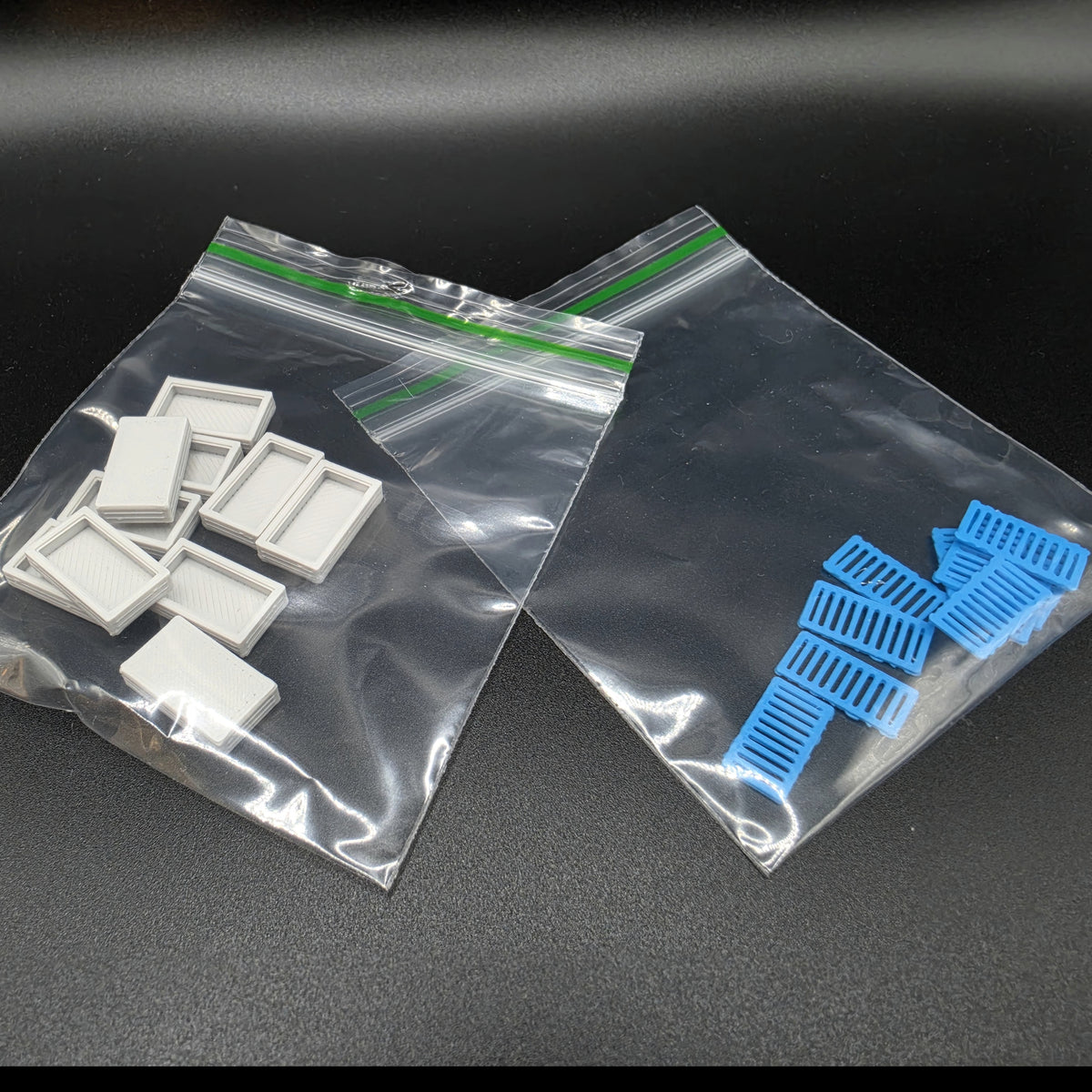 Pack contents for ten coloured OO gauge drainage catchpits